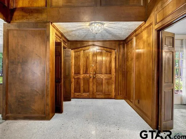 a bathroom with a granite countertop shower