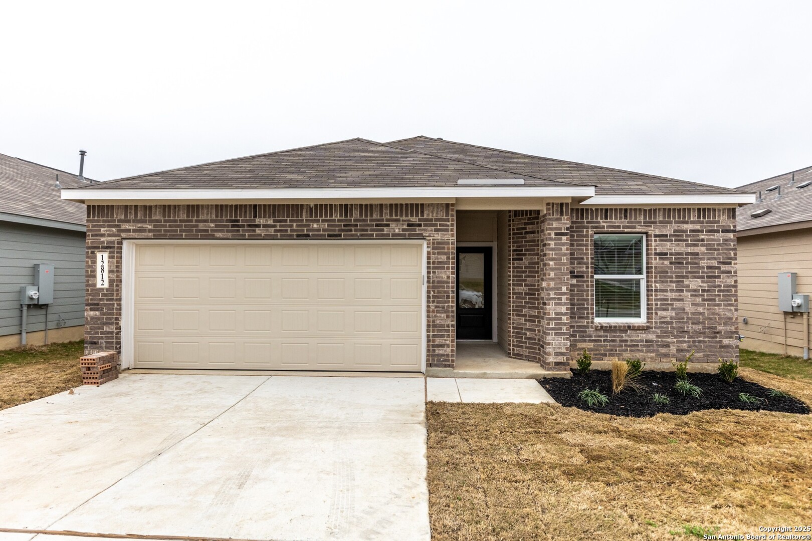 a front view of a house with yard