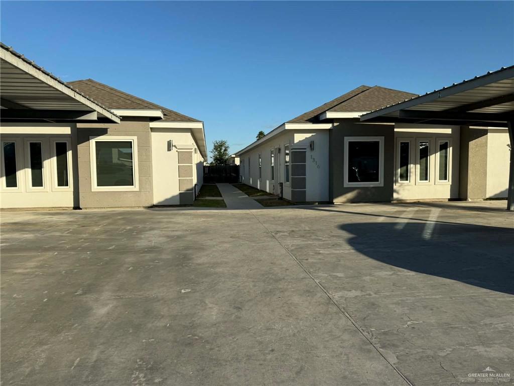 1316 South Xanthia Street, Unit 4 Mission, TX 78573 - Photo 1 of 17 a front view of a house with a yard