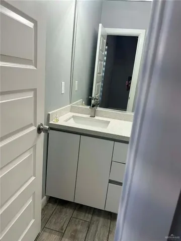 a view of hallway with wooden floor