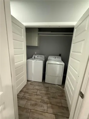 a bathroom with a double vanity sink toilet and shower