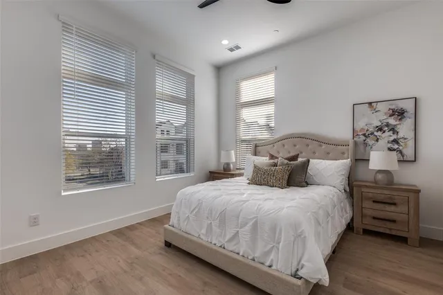 a bedroom with bed and a window