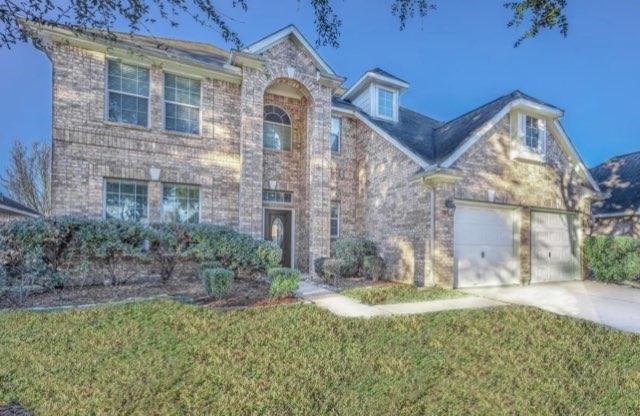 7635 Golden Thistle Lane Cypress, TX 77433 - Photo 1 of 15 a view of a house with a yard