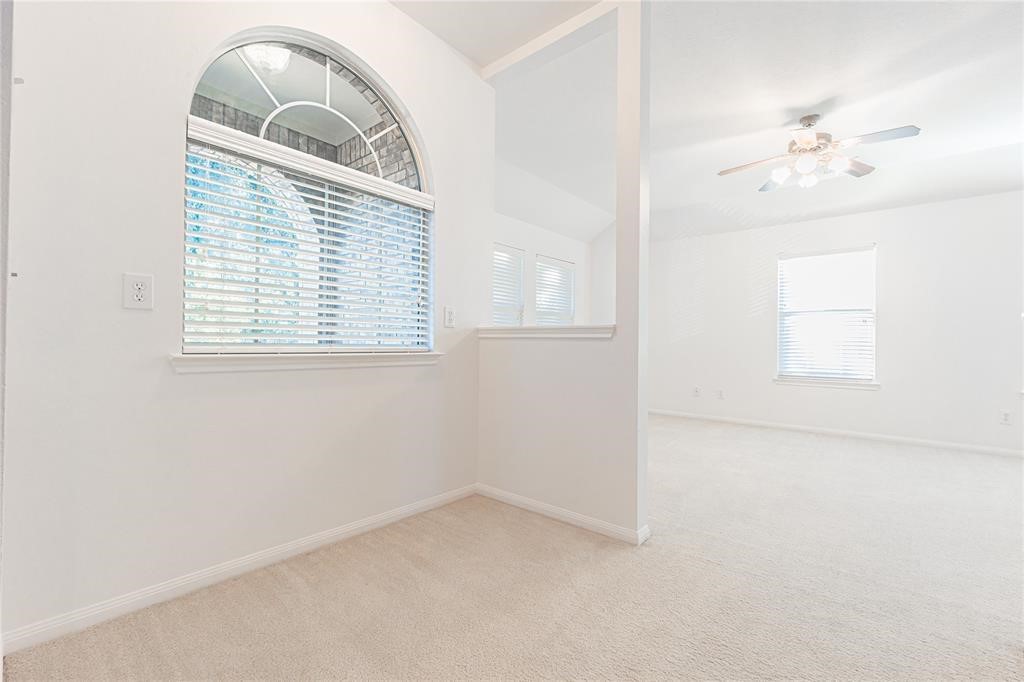 7635 Golden Thistle Lane Cypress, TX 77433 - Photo 13 of 15 an empty room with a window