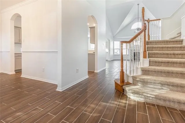 a view of entryway and hall with wooden floor