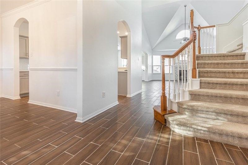 7635 Golden Thistle Lane Cypress, TX 77433 - Photo 2 of 15 a view of entryway and hall with wooden floor