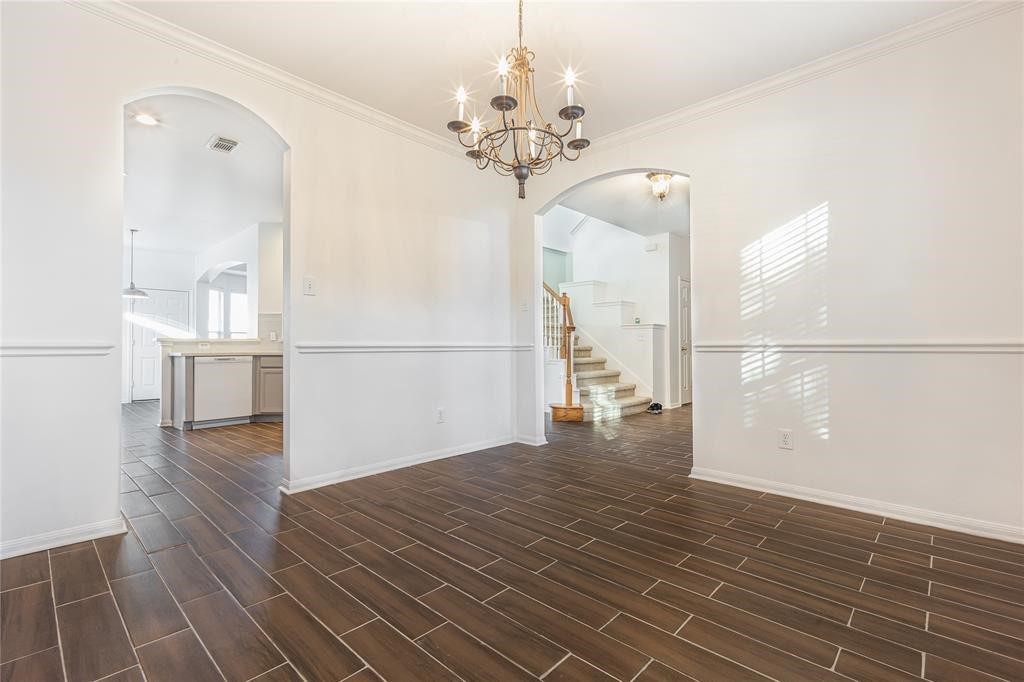 7635 Golden Thistle Lane Cypress, TX 77433 - Photo 5 of 15 a view of a room with wooden floor and staircase