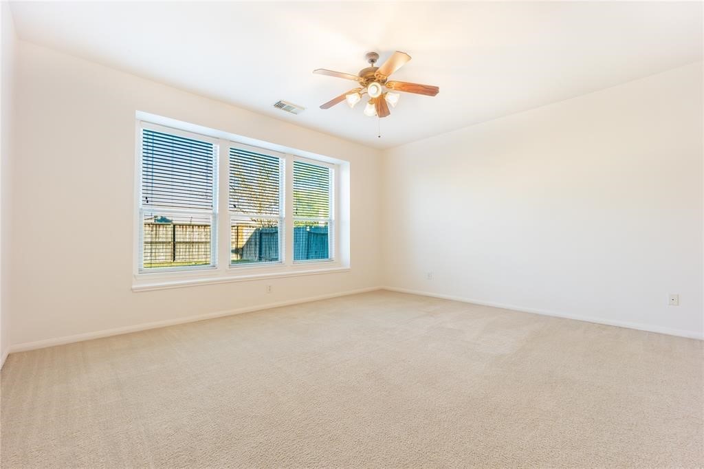 7635 Golden Thistle Lane Cypress, TX 77433 - Photo 9 of 15 an empty room with a window
