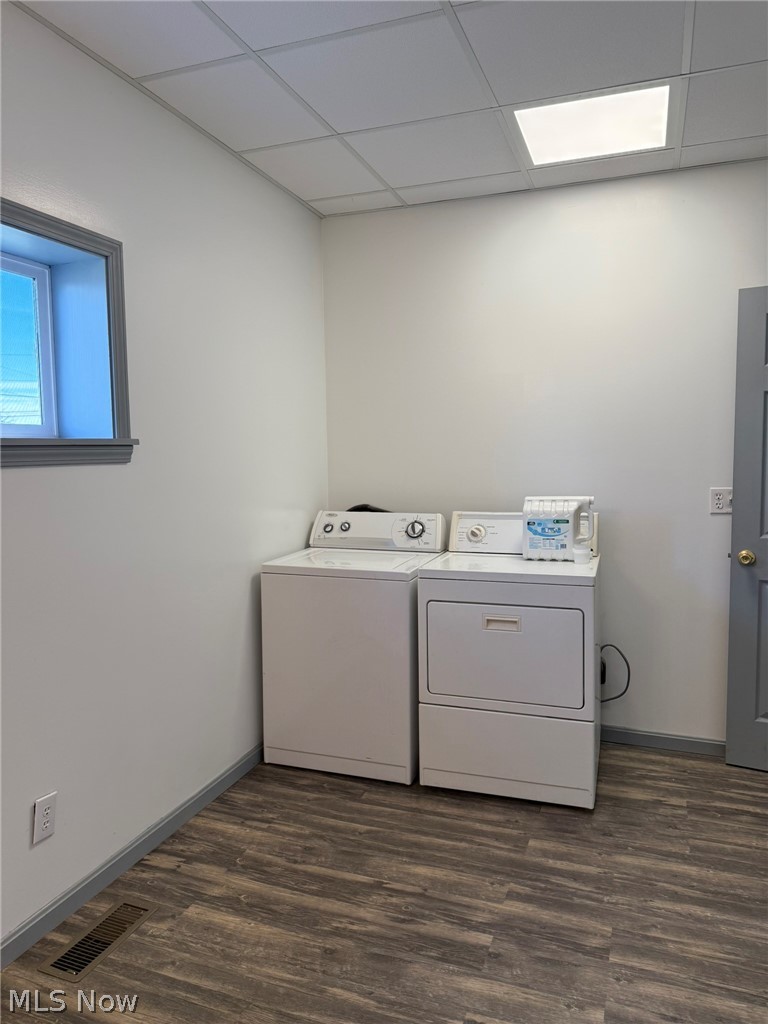23033 Cadiz Road Freeport, OH 43973 - Photo 14 of 31 Laundry area featuring dark wood-style flooring, a drop ceiling, and washer and clothes dryer