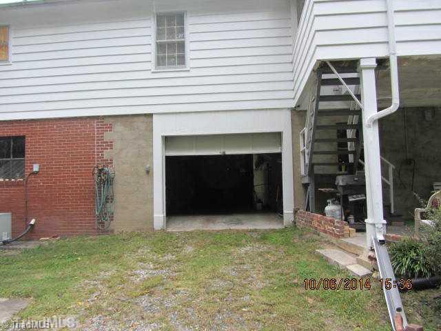 211 Country Club Road Mount Airy, NC 27030 - Photo 14 of 16 Other. Basement Garage. Workshop to the left and den with fireplace would be to the right.