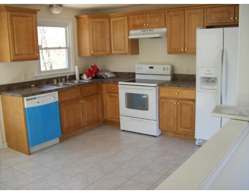 184 Lamont Street Springfield, MA 01119 - Photo 3 of 5 a kitchen with stainless steel appliances granite countertop a sink stove and refrigerator