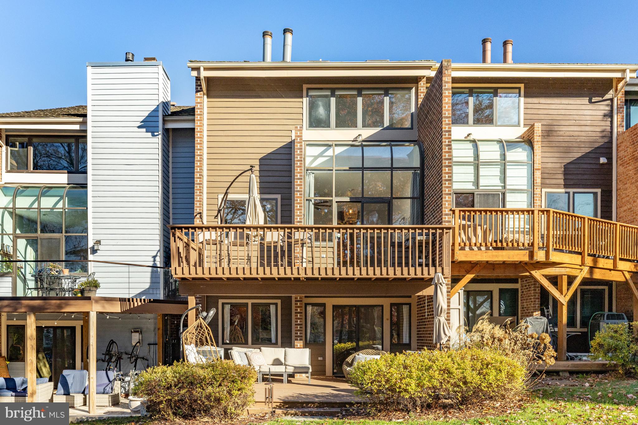 11010 Thrush Ridge Road Reston, VA 20191 - Photo 53 of 87 a front view of a residential apartment building with a yard