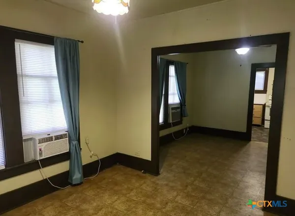 an empty room with windows