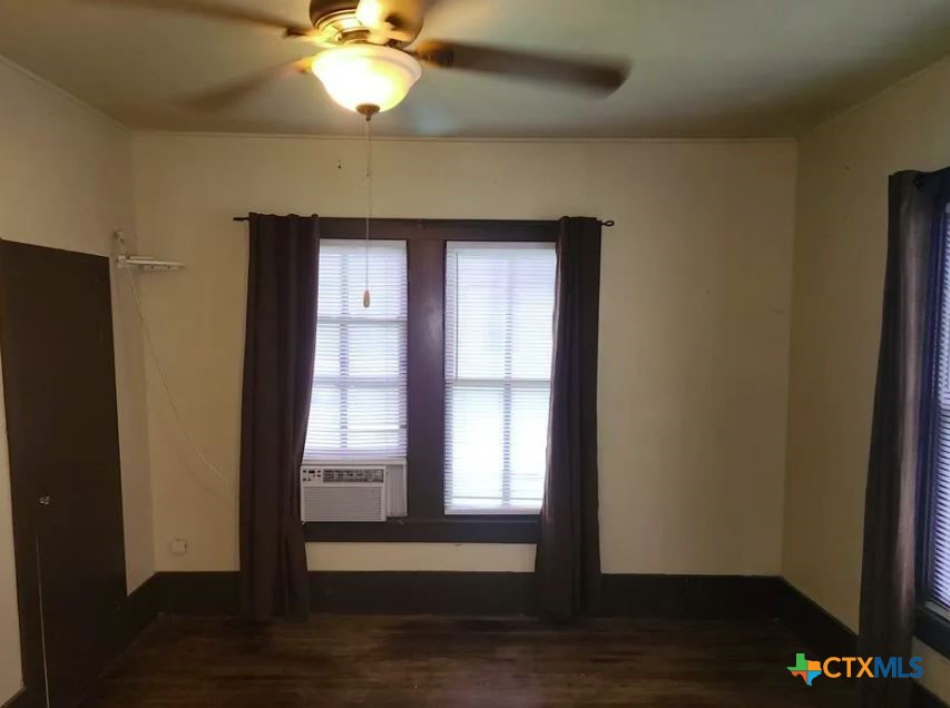 121 Ave G Shiner, TX 77984 - Photo 6 of 7 a view of empty room with wooden floor and fan