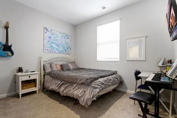 a bedroom with a bed and a closet