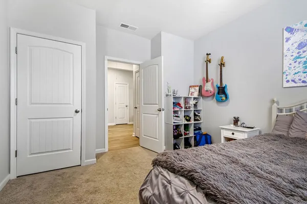 a kitchen with a sink appliances and wooden floor