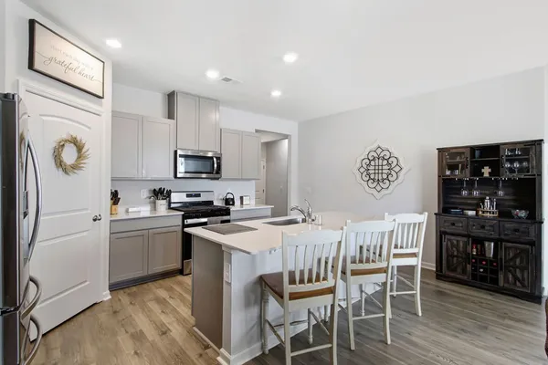 a view of a dining room with furniture and wooden floor