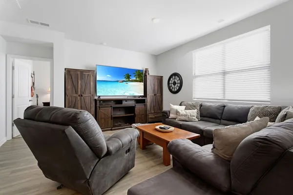 a living room with furniture and a couch