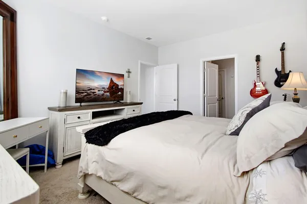 a bathroom with double sink and a mirror