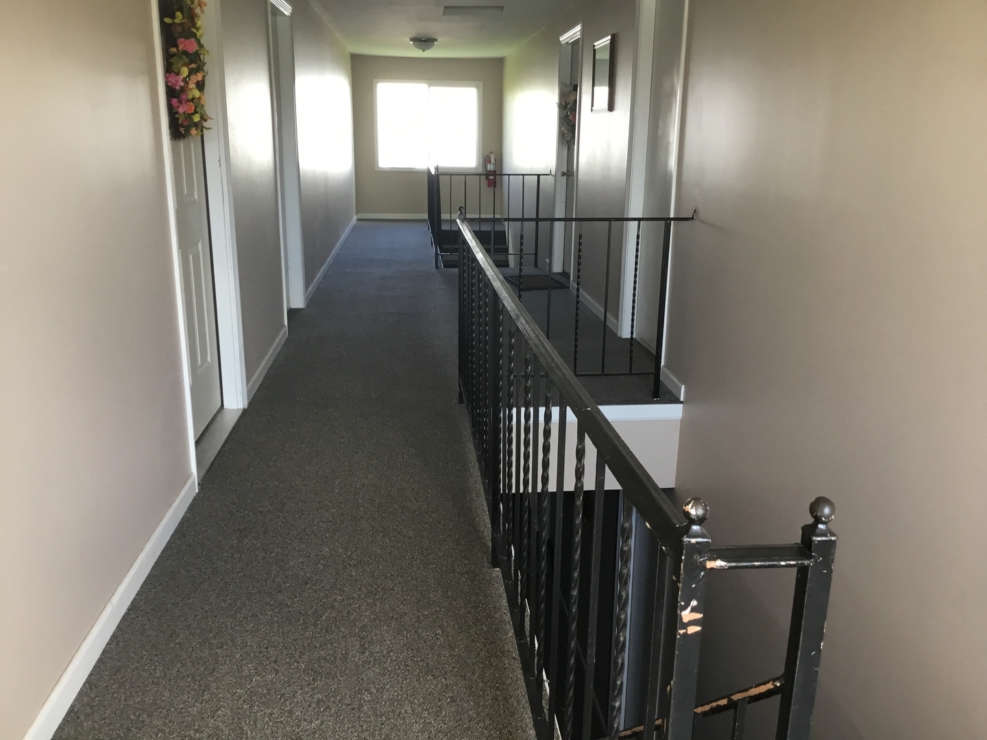 1115 Shagbark Road, Unit 2B New Lenox, IL 60451 - Photo 15 of 19 a view of a hallway with wooden floor and stairs