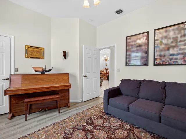 a living room with furniture and a rug