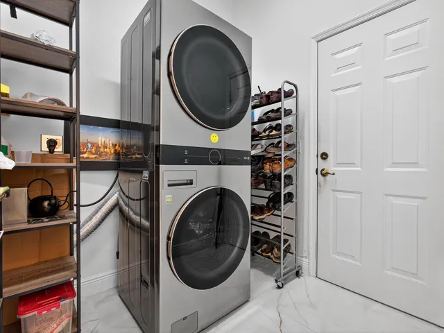 a view of a storage & utility room with washer and dryer