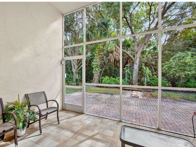 a view of a chair and table on the patio