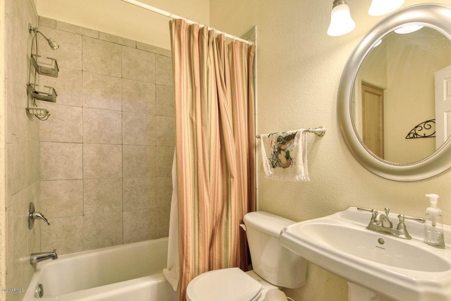 11500 South Duck Tank Road Pearce, AZ 85625 - Photo 19 of 38 a bathroom with a sink toilet and shower