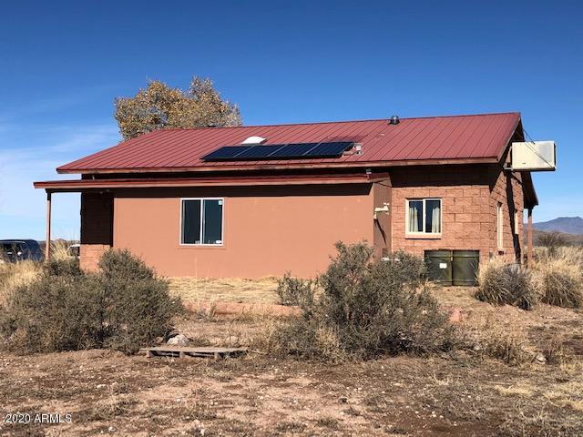 11500 South Duck Tank Road Pearce, AZ 85625 - Photo 29 of 38 a front view of a house with a yard