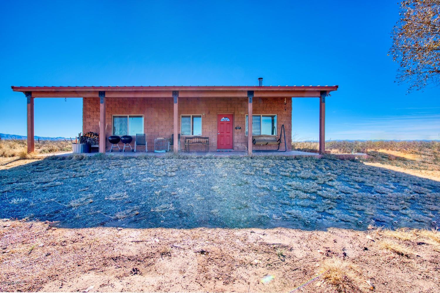 11500 South Duck Tank Road Pearce, AZ 85625 - Photo 5 of 38 a front view of a house with a yard