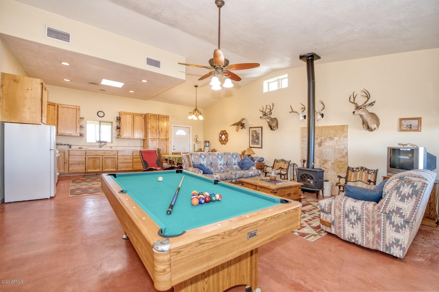 11500 South Duck Tank Road Pearce, AZ 85625 - Photo 9 of 38 a room with pool table and windows
