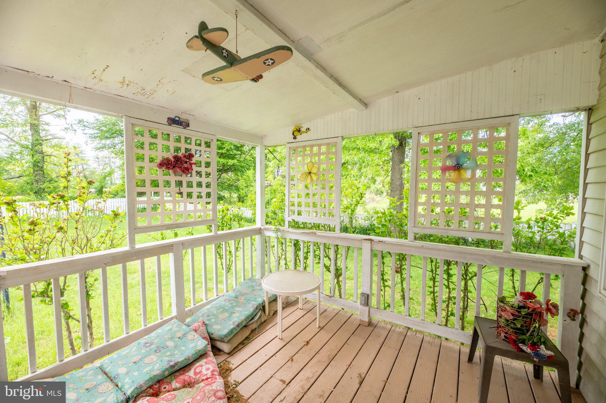 57 Diverty Road Pennington, NJ 08534 - Photo 62 of 86 Charming porch with lush garden views.