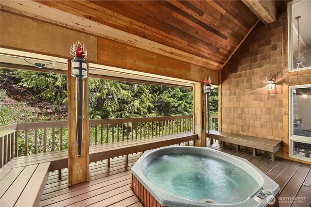 a dining room with livingroom view and wooden floor