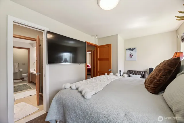 a bathroom with a sink double vanity granite and a mirror