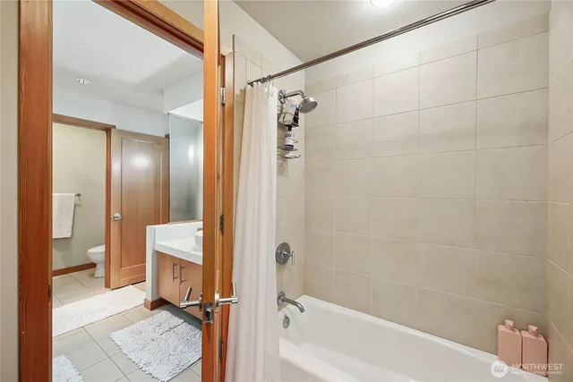a view of room with stairs and wooden floor