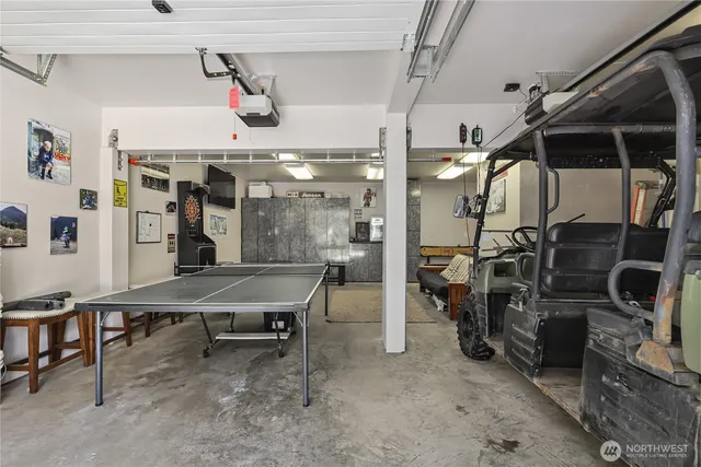 an aerial view of a house with garden space and street view