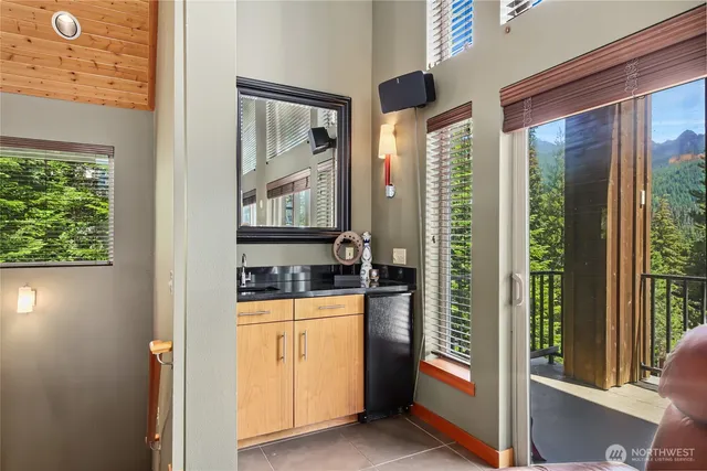 a kitchen with granite countertop a refrigerator and a stove
