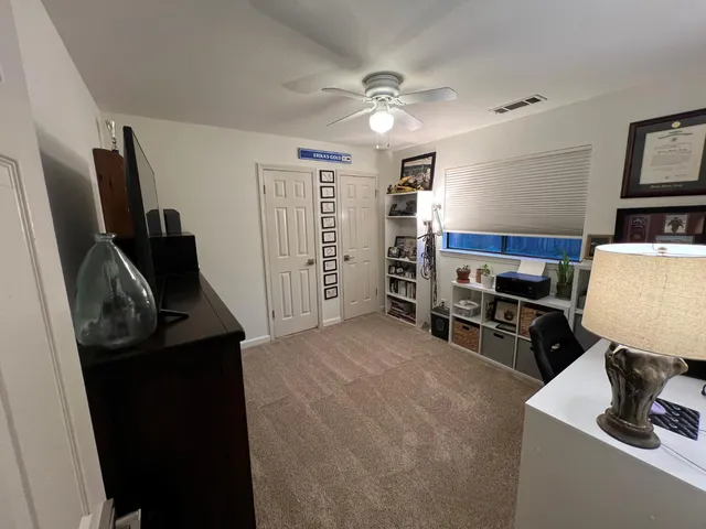 a view of a workspace with furniture and washer