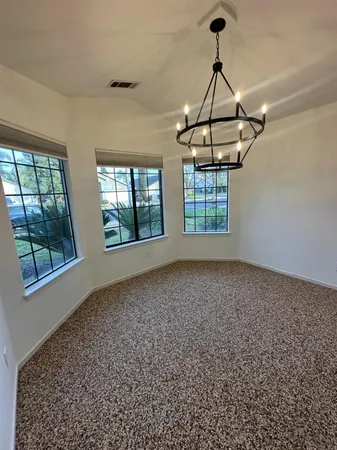 a view of empty room with windows