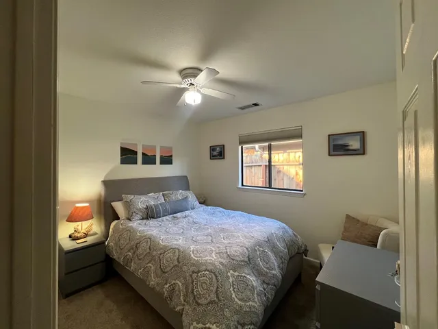 a bedroom with a bed and window