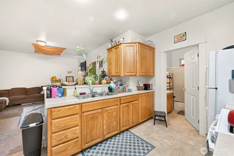 a kitchen with a sink cabinets and appliances