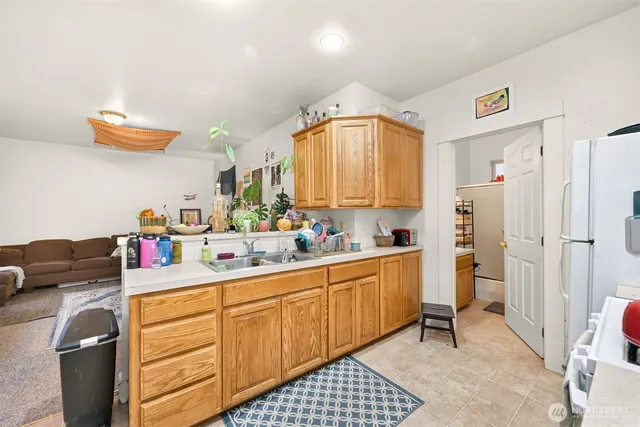 a kitchen with a sink cabinets and appliances