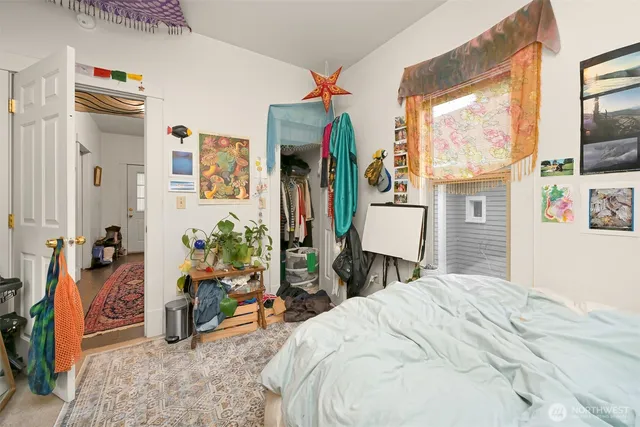 a bedroom with furniture and a window