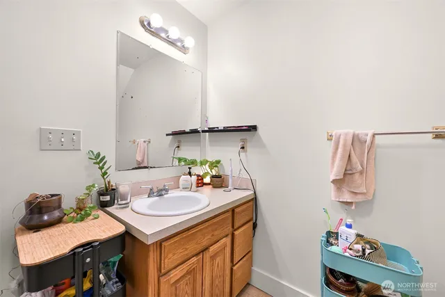 a bathroom with a sink and a mirror
