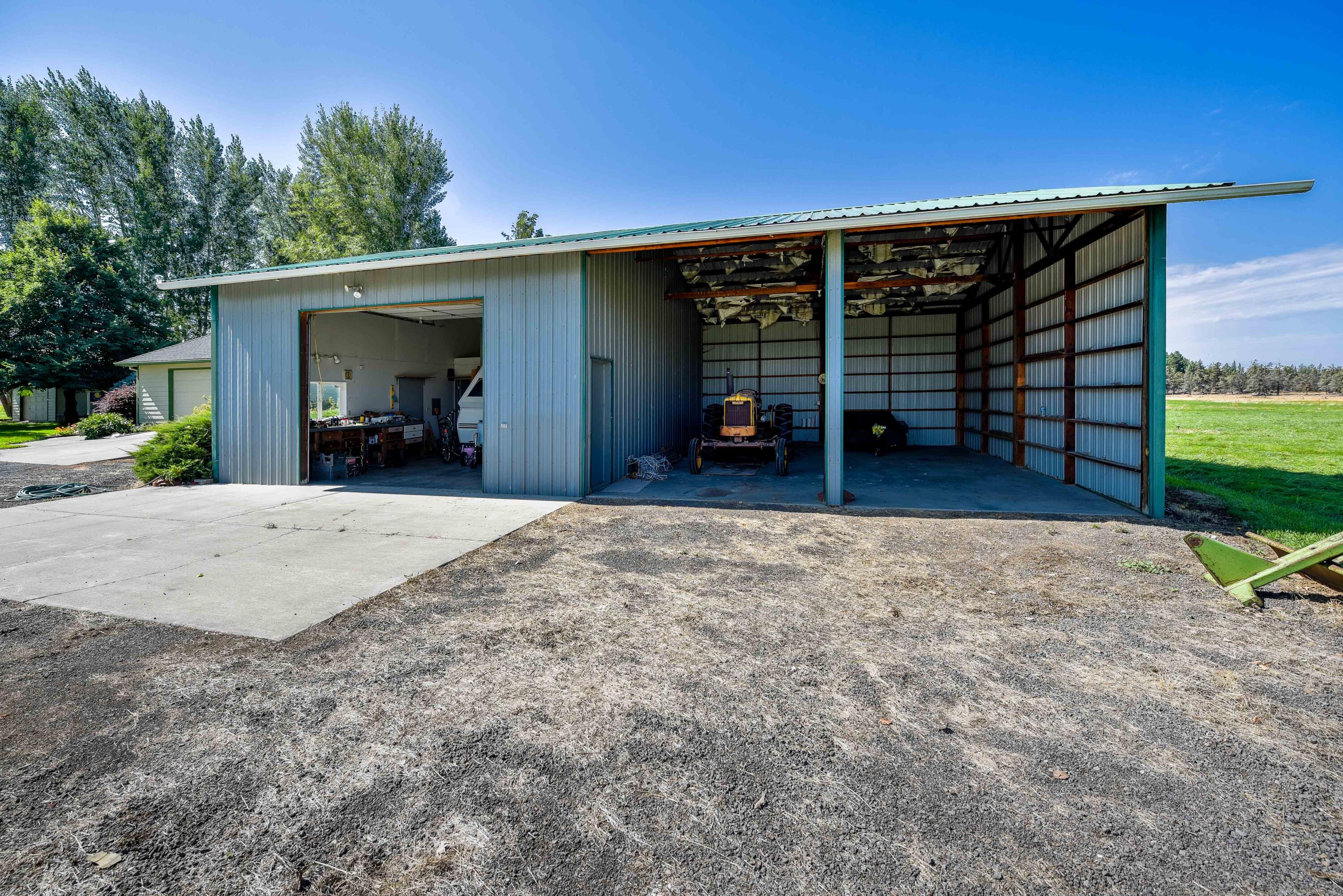63475 Cricketwood Road Bend, OR 97701 - Photo 35 of 64 a view of a house with a backyard and porch
