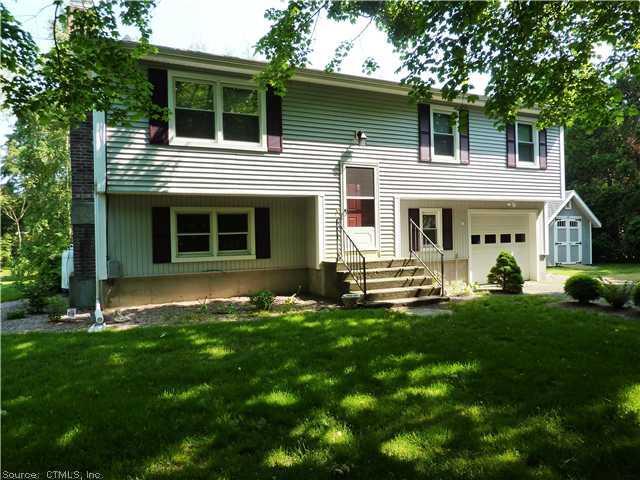 8A Bailey Road Old Lyme, CT 06371 - Photo 1 of 1 a front view of a house with a garden