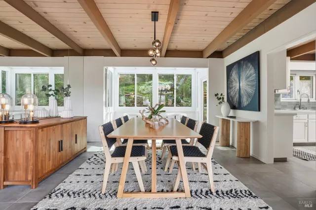 a view of a dining room with furniture window and outside view