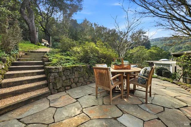 a view of a tables and chairs on the patio