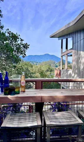 a view of a chairs and table in patio
