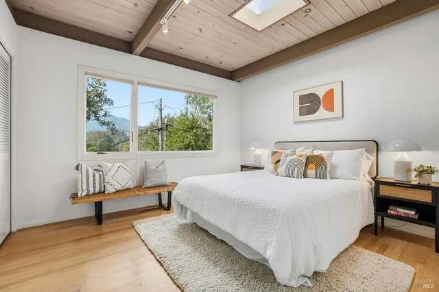 a bedroom with a bed and a couch